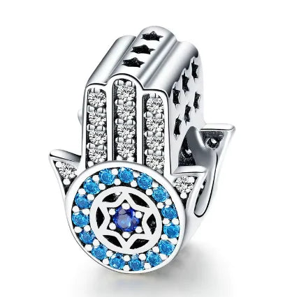 Dije de mano de dios con ojo de diablo