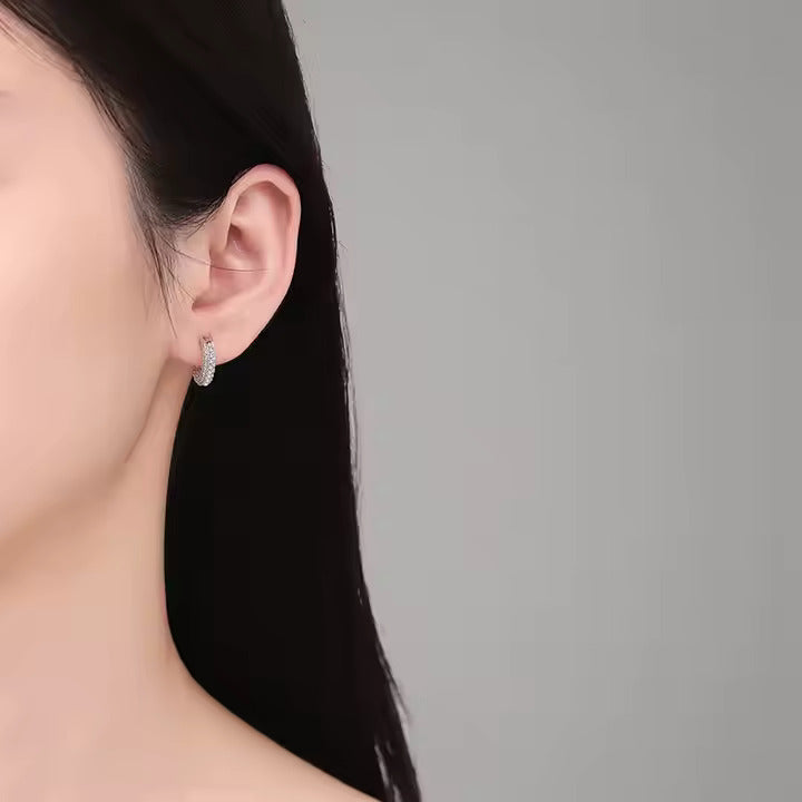 Delicate 925 silver earrings with micro-inlaid moissanite. Subtle sparkle perfect.